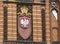 Polish crest on a red brick building in Koszalin post office