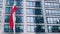 Polish flag waving in front of modern corporate office building, national independence day