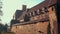 Polish national flag flying over medieval castle in Malbork