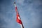 Polish national flags on a building in a slight breeze