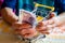 A Polish pensioner holds a thumbnail of an empty shopping trolley and 20 Polish zlotys in her hands, The concept of low pensions