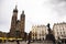 Polish or Pole people and foreigner travelers travel visit St. Mary Basilica with Adam Mickiewicz Monument statue in Krakow Old