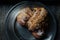 Polish traditional Saint Martin`s croissants called rogal swietomarcinski with white poppies on silver plate