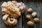 Polish traditional Saint Martin`s croissants rogal swietomarcinski and fresh almonds in shell on wooden background