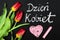 Polish Womens Day card and a bouquet of beautiful tulips on blackboard background,