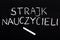 Polish word TEACHERS STRIKE on a chalkboard