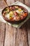 Polish Zurek soup with sausage, vegetables and eggs on the table