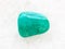 polished amazonite gemstone on white marble