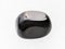 polished black Onyx gemstone on white marble