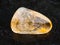 polished Citrine gemstone on dark background