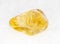 polished Citrine (yellow quartz) gem on white