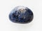 polished dumortierite gem stone on white marble