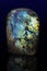 Polished gemstone labradorite labrador stone on dark background