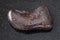 polished hydrogoethite gemstone on dark