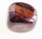 polished jaspilite gemstone on white