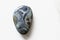 Polished kambaba jasper gemstone on a white background