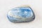 Polished Kyanite rock on white marble