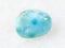 polished Larimar gemstone on white