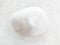 polished magnesite gemstone on white marble