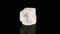 Polished mineral stone iceland spar rotates in a circle on a black background