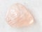 polished morganite (pink beryl) gemstone on white