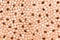 Polished pebbles background. Color of the Year 2024 Peach Fuzz