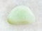 polished Prasiolite gemstone on white marble