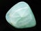 polished Prehnite gemstone on dark background