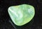 polished Prehnite rock on black