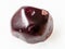 polished red garnet gemstone on white