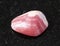 Polished Rhodochrosite rock on black