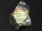 polished slab of labradorite stone on dark