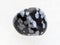 polished snowflake obsidian gemstone on white