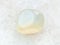 polished translucent moonstone gem stone on white