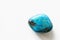 Polished tumbled chrysocolla stone on a white background