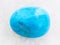 polished Turquenite (blue howlite) stone on white