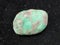 polished Variscite gemstone on dark background