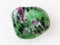 polished zoisite (anyolite) gemstone on white