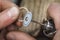 Polishing a gold ring in a jewelry workshop. The master is engaged in processing the product