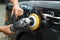 Polishing a used car with an electrical orbital buffer or polisher