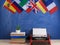 Political, news and education concept - red typewriter, flags of Spain, France, Great Britain and other countries, books