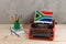 Political, news and education concept - red vintage typewriter, flag of the South Africa, pencil