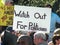 Political Rally with protest sign stating `Watch Out for Politicians`