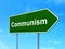 Politics concept: Communism on road sign background