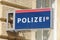 Polizei sign hanging on the facade of a Police station