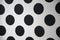 Polka dot array designs with black dots and white backdrop