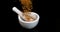 Pollen Dumplings Falling on Black Background, mortar and pestle, Slow Motion