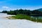 Polluted lake with kaolin on abandoned quarry with beautiful blue sky