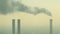 Pollution from industrial factory chimneys on the skyline of Berlin, Germany