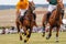 Polo match with horses galloping